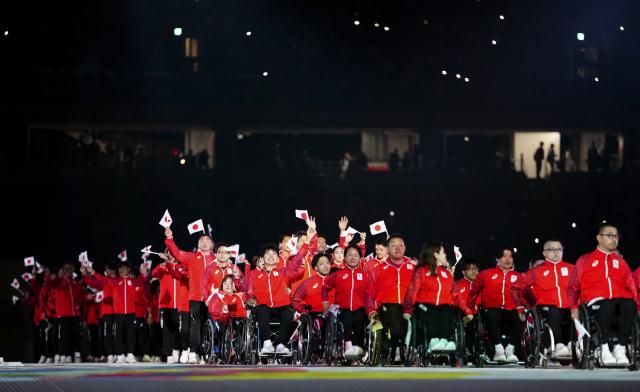 (261018) -- NAGOYA, Oct. 18, 2026 (Xinhua) -- The delegation of Japan parades into the stadium during the opening ceremony of the Aichi-Nagoya Asian Para Games in Nagoya, Japan, Oct. 18, 2026. (Xinhua/Jia Haocheng)