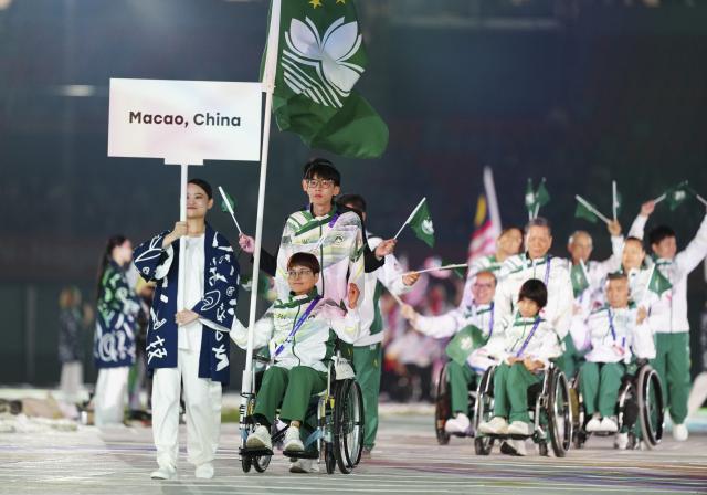 (261018) -- NAGOYA, Oct. 18, 2026 (Xinhua) -- The delegation of China's Macao parades into the stadium during the opening ceremony of the Aichi-Nagoya Asian Para Games in Nagoya, Japan, Oct. 18, 2026. (Xinhua/Yao Qilin)