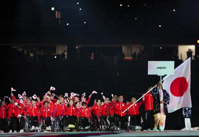 (261018) -- NAGOYA, Oct. 18, 2026 (Xinhua) -- The delegation of Japan parades into the stadium during the opening ceremony of the Aichi-Nagoya Asian Para Games in Nagoya, Japan, Oct. 18, 2026. (Xinhua/Jia Haocheng)