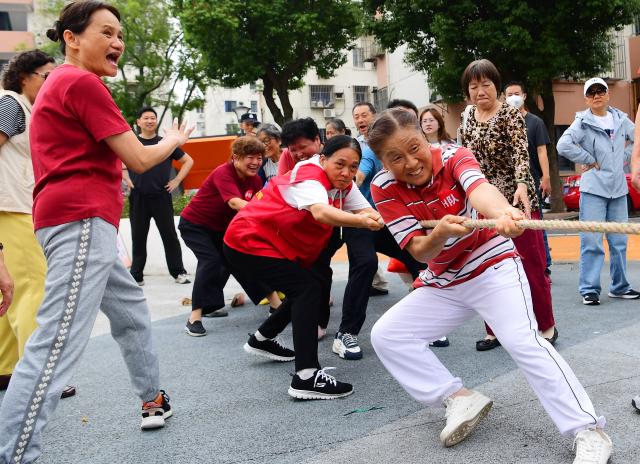 (261018) -- BEIJING, Oct. 18, 2026 (Xinhua) -- Senior citizens take part in a tug-of-war competition during an event marking the Chongyang Festival in Wuxi, east China's Jiangsu Province, Oct. 18, 2026. A series of celebration activities were held across the country to mark the Chongyang Festival, which falls on Oct. 18 this year. Also known as China's Seniors' Day, it honors the country's traditional virtues of filial piety and family love. (Photo by Huan Yueliang/Xinhua)