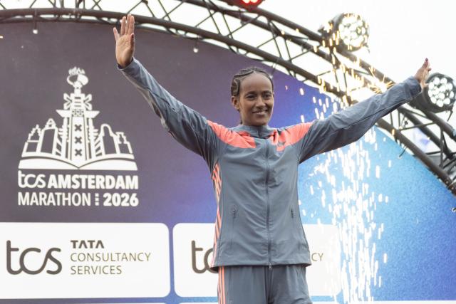 (261018) -- AMSTERDAM, Oct. 18, 2026 (Xinhua) -- Buze Diriba of Ethiopia is pictured on the podium after winning the women's race of the Amsterdam Marathon in Amsterdam, the Netherlands, Oct. 18, 2026. (Photo by Sylvia Lederer/Xinhua)