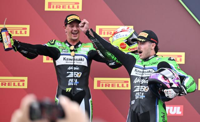 (261018) -- JEREZ, Oct. 18, 2026 (Xinhua) -- Jeremy Alcoba (R) and Dominique Aegerter of Kawasaki WorldSSP Team celebrate on the podium after the Race 2 of WorldSSP at the FIM Supersport World Championship Spanish Round in Jerez, Spain, Oct. 18, 2026. (Xinhua/Cheng Min)