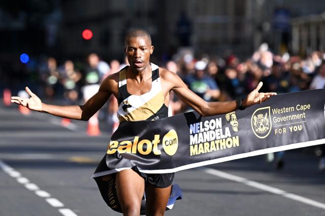 (261018) -- CAPE TOWN, Oct. 18, 2026 (Xinhua) -- South Africa's Arthur Jantjies crosses the finish line to win the men's race at the inaugural Nelson Mandela Marathon in Cape Town, South Africa, Oct. 18, 2026. (Photo by Xabiso Mkhabela/Xinhua)