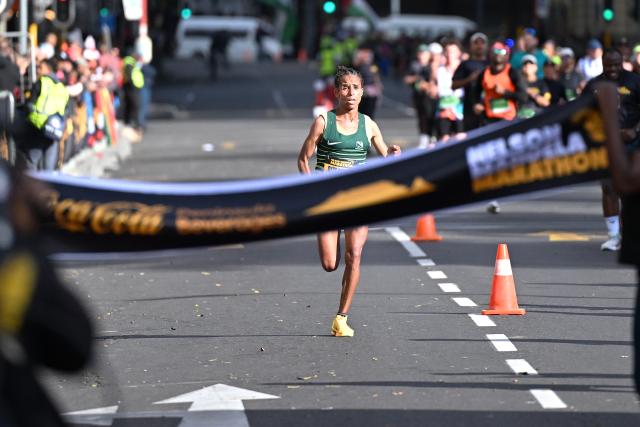 (261018) -- CAPE TOWN, Oct. 18, 2026 (Xinhua) -- Ethiopia's Bize Beyira Negasa crosses the finish line to win the women's race at the inaugural Nelson Mandela Marathon in Cape Town, South Africa, Oct. 18, 2026. (Photo by Xabiso Mkhabela/Xinhua)