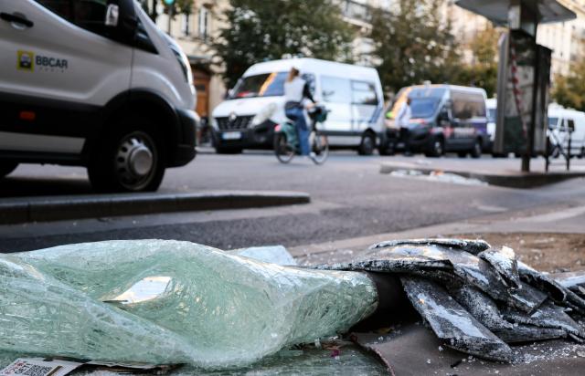 (261018) -- PARIS, Oct. 18, 2026 (Xinhua) -- Glass shattered during a protest is seen on a street in Paris, France, Oct. 18, 2026. French President Emmanuel Macron on Sunday vowed legal action against those responsible for violence during protests across the country on Saturday. (Xinhua/Wu Huiwo)