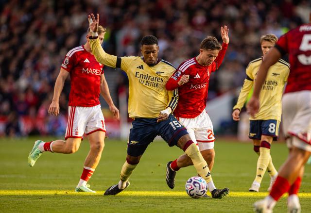 (261019) -- NOTTINGHAM, Oct. 19, 2026 (Xinhua) -- Arsenal's Ezri Konsa (L) vies for the ball during the English Premier League match between Nottingham Forest FC and Arsenal FC in Nottingham, Britain, on Oct. 18, 2026. (Xinhua)
FOR EDITORIAL USE ONLY. NOT FOR SALE FOR MARKETING OR ADVERTISING CAMPAIGNS. NO USE WITH UNAUTHORIZED AUDIO, VIDEO, DATA, FIXTURE LISTS, CLUB/LEAGUE LOGOS OR "LIVE" SERVICES. ONLINE IN-MATCH USE LIMITED TO 45 IMAGES, NO VIDEO EMULATION. NO USE IN BETTING, GAMES OR SINGLE CLUB/LEAGUE/PLAYER PUBLICATIONS.