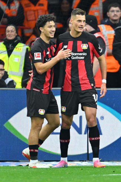(261019) -- LEVERKUSEN, Oct. 19, 2026 (Xinhua) -- Patrik Schick (R) of Bayer 04 Leverkusen celebrates scoring with teammate Ibrahim Maza during the German first division of Bundesliga football match between Bayer 04 Leverkusen and SC Freiburg in Leverkusen, Germany, Oct. 18, 2026. (Photo by Ulrich Hufnagel/Xinhua)