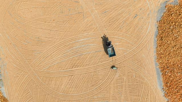 (261019) -- BEIJING, Oct. 19, 2026 (Xinhua) -- An aerial drone photo taken on Oct. 15, 2026 shows a farmer operating at an airing yard of a grain cooperative in Taizi Town of Zouping City, east China's Shandong Province. China's gross domestic product (GDP) grew 4.5 percent year on year in the third quarter (Q3) of 2026, data from the National Bureau of Statistics (NBS) showed Monday.
  The country's economy expanded 4.6 percent year on year in the first three quarters.
  The world's second-largest economy generated about 107.11 trillion yuan (about 15.94 trillion U.S. dollars) in output during the January-September period, according to the NBS. (Photo by Dong Naide/Xinhua)