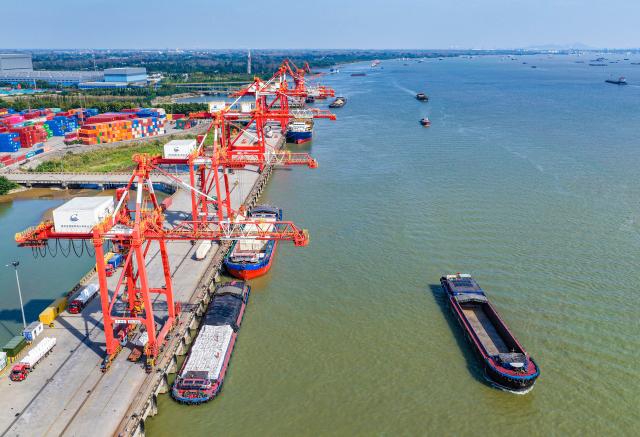 (261019) -- BEIJING, Oct. 19, 2026 (Xinhua) -- A drone photo taken on Oct. 14, 2026 shows the Yangzhou Port in Yangzhou, east China's Jiangsu Province. China's gross domestic product (GDP) grew 4.5 percent year on year in the third quarter (Q3) of 2026, data from the National Bureau of Statistics (NBS) showed Monday.
  The country's economy expanded 4.6 percent year on year in the first three quarters.
  The world's second-largest economy generated about 107.11 trillion yuan (about 15.94 trillion U.S. dollars) in output during the January-September period, according to the NBS. (Photo by Ren Fei/Xinhua)