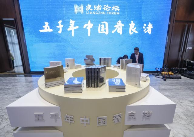 (261019) -- HANGZHOU, Oct. 19, 2026 (Xinhua) -- Newly released books are pictured during a sub-forum titled "Tracing Origins: Archaeological Evidence and Legacy of Early Civilization-Commemorating the 90th Anniversary of the Discovery of the Liangzhu Site" of the fourth Liangzhu Forum in Hangzhou, east China's Zhejiang Province, Oct. 19, 2026. The year 2026 marks the 90th anniversary of the discovery of the Liangzhu ruins. The fourth Liangzhu Forum, which opened Sunday in Hangzhou, has rolled out a series of concurrent cultural events including a sub-forum, a themed special exhibition and a tour in the Archaeological Ruins of Liangzhu City Park. (Xinhua/Xu Yu)