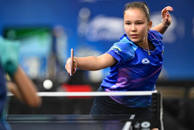 (261019) -- TASHKENT, Oct. 19, 2026 (Xinhua) -- Adelina Khasanova of Uzbekistan hits a return to Leong I Nam of China's Macao during the women's team group match between China's Macao and Uzbekistan at the 29th ITTF-Asian Table Tennis Championships in Tashkent, Uzbekistan, Oct. 19, 2026. (Xinhua/Feng Kaihua)