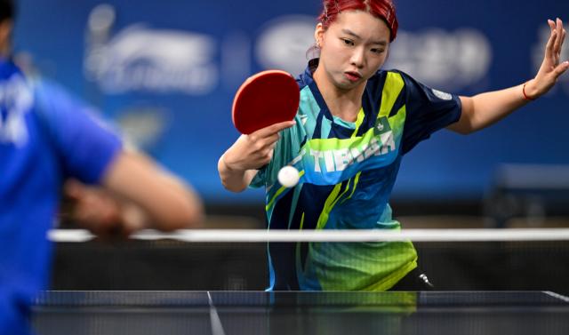 (261019) -- TASHKENT, Oct. 19, 2026 (Xinhua) -- Seak Hui Li of China's Macao hits a return to Arujan Kamalova of Uzbekistan during the women's team group match between China's Macao and Uzbekistan at the 29th ITTF-Asian Table Tennis Championships in Tashkent, Uzbekistan, Oct. 19, 2026. (Xinhua/Feng Kaihua)