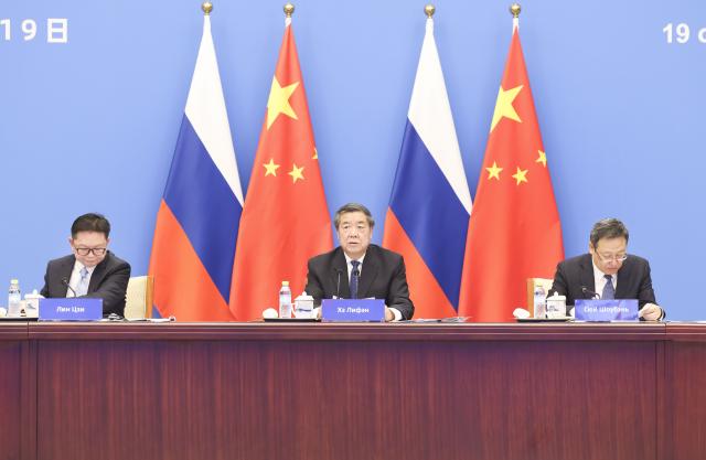 (261019) -- BEIJING, Oct. 19, 2026 (Xinhua) -- Chinese Vice Premier He Lifeng co-chairs the 30th session of the committee for regular meetings between the Chinese and Russian heads of government, together with Russian Deputy Prime Minister Dmitry Chernyshenko via video link, Oct. 19, 2026. (Xinhua/Pang Xinglei)