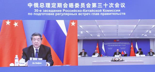 (261019) -- BEIJING, Oct. 19, 2026 (Xinhua) -- Chinese Vice Premier He Lifeng co-chairs the 30th session of the committee for regular meetings between the Chinese and Russian heads of government, together with Russian Deputy Prime Minister Dmitry Chernyshenko via video link, Oct. 19, 2026. (Xinhua/Pang Xinglei)