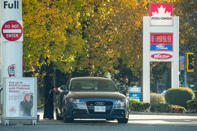 (261019) -- VANCOUVER, Oct. 19, 2026 (Xinhua) -- A woman fuels her car at a gas station in Vancouver, British Columbia, Canada, on Oct. 19, 2026. Canada's Consumer Price Index (CPI) rose 3.1 percent year over year in September, following a 3-percent increase in August, Statistics Canada said Monday. (Photo by Liang Sen/Xinhua)