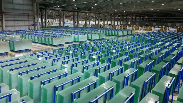 (261020) -- ZHAOTONG, Oct. 20, 2026 (Xinhua) -- A drone photo taken on Oct. 19, 2026 shows the photovoltaic glass products in the workshop of Zhaotong Kibing Photovoltaic Technology Co,. Ltd. in Zhaotong City, southwest China's Yunnan Province. Leveraging its advantages in rich resources of silicon ore and the development of green electricity, Zhaotong City has attracted leading enterprises to develop the photovoltaic glass manufacturing industry, bringing about employment for surrounding residents. Currently, the city has basically formed an industrial chain from silicon mining and washing to the manufacturing of photovoltaic glass and photovoltaic modules. (Xinhua/Peng Yikai)