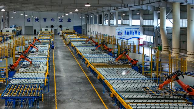 (261020) -- ZHAOTONG, Oct. 20, 2026 (Xinhua) -- A drone photo taken on Oct. 19, 2026 shows a view in the workshop of Zhaotong Kibing Photovoltaic Technology Co,. Ltd. in Zhaotong City, southwest China's Yunnan Province. Leveraging its advantages in rich resources of silicon ore and the development of green electricity, Zhaotong City has attracted leading enterprises to develop the photovoltaic glass manufacturing industry, bringing about employment for surrounding residents. Currently, the city has basically formed an industrial chain from silicon mining and washing to the manufacturing of photovoltaic glass and photovoltaic modules. (Xinhua/Peng Yikai)