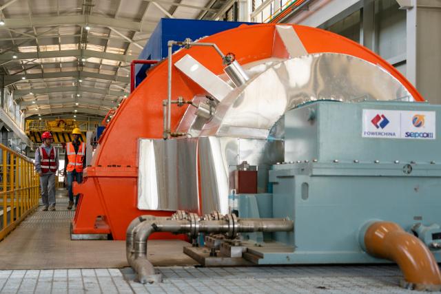 (261020) -- NAKURU, Oct. 20, 2026 (Xinhua) -- Staff members inspect the equipment at Olkaria I Geothermal Power Plant at Hell's Gate National Park in Nakuru County, Kenya, Oct. 19, 2026. Geothermal has consistently contributed 40 to 48 percent of Kenya's electricity in recent years, according to data released from Kenya's Energy and Petroleum Regulatory Authority and the International Energy Agency. Much of this output comes from the Olkaria geothermal field, which is located within Hell's Gate along the Great Rift Valley. (Xinhua/Xie Jianfei)