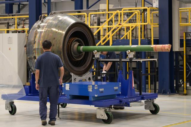 (261020) -- HAIKOU, Oct. 20, 2026 (Xinhua) -- Staff members work at an aero-engine maintenance base of the comprehensive bonded zone of Haikou Airport in Haikou, south China's Hainan Province, Oct. 19, 2026. Leveraging policy benefits and regional advantages, Hainan Free Trade Port (FTP) has vigorously developed its aviation maintenance industry, establishing an international aviation maintenance hub. (Xinhua/Xin Yuewei)