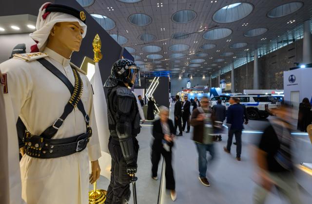 (261020) -- DOHA, Oct. 20, 2026 (Xinhua) -- People visit the Milipol Qatar 2026, an international event for homeland security and civil defense, at Doha Exhibition and Convention Center in Doha, Qatar, Oct. 20, 2026. The three-day exhibition attracted more than 270 exhibitors. (Photo by Nikku/Xinhua)