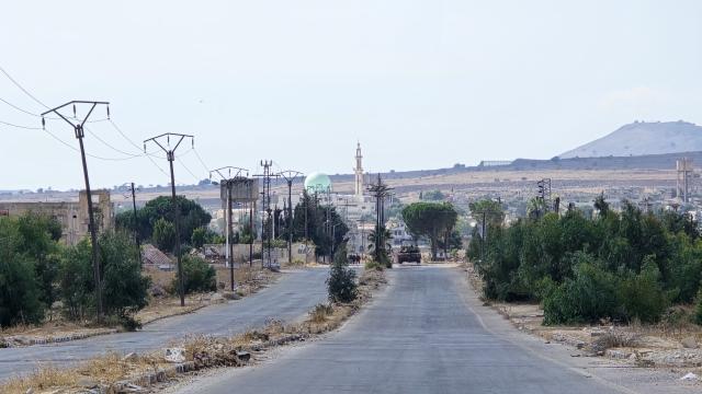 (261020) -- QUNEITRA, Oct. 20, 2026 (Xinhua) -- An Israeli tank is stationed near the former governorate building in Quneitra province, southern Syria, Oct. 20, 2026. Israeli forces advanced into Syria's southern Quneitra province on Tuesday with seven military vehicles and two tanks, Syrian state TV Al-Ikhbariya reported. The Israeli military convoy entered northern Quneitra countryside before taking up positions near the former governorate headquarters, it said. (Str/Xinhua)
