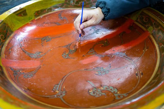 (261020) -- JINGZHOU, Oct. 20, 2026 (Xinhua) -- A staff member restores a lacquered artifact at the cultural relics protection center in Jingzhou, central China's Hubei Province, Oct. 19, 2026.
  Established in 2003, the cultural relics protection center in Jingzhou undertakes the conservation of about 80 percent of China's waterlogged bamboo and wooden slips. The center has developed comprehensive conservation techniques for such slips, covering sectors from archaeological excavation and laboratory conservation to display and storage. 
  To date, the center has provided technical support in cultural relic conservation to more than 130 cultural and museum institutions across the country, and has restored more than 10,000 lacquered wooden artifacts, over 180,000 bamboo and wooden slips, and more than 1,100 textile artifacts. (Xinhua/Xiao Yijiu)