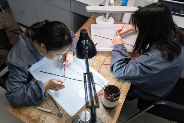 (261020) -- JINGZHOU, Oct. 20, 2026 (Xinhua) -- Staff members clear bamboo slips at the cultural relics protection center in Jingzhou, central China's Hubei Province, Oct. 19, 2026.
  Established in 2003, the cultural relics protection center in Jingzhou undertakes the conservation of about 80 percent of China's waterlogged bamboo and wooden slips. The center has developed comprehensive conservation techniques for such slips, covering sectors from archaeological excavation and laboratory conservation to display and storage. 
  To date, the center has provided technical support in cultural relic conservation to more than 130 cultural and museum institutions across the country, and has restored more than 10,000 lacquered wooden artifacts, over 180,000 bamboo and wooden slips, and more than 1,100 textile artifacts. (Xinhua/Xiao Yijiu)