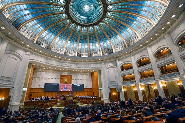 (261020) -- BUCHAREST, Oct. 20, 2026 (Xinhua) -- Romanian Prime Minister designate Luca Niculescu delivers a speech during a confidence vote session at Parliament in Bucharest, Romania, Oct. 20, 2026. Romanian parliament approved Luca Niculescu's government on Tuesday, ending a political crisis that has lasted nearly six months.
According to Romania's national news agency Agerpres, of 338 valid votes cast, 280 lawmakers voted in favor of the government's investiture while 58 voted against. (Photo by Cristian Cristel/Xinhua)