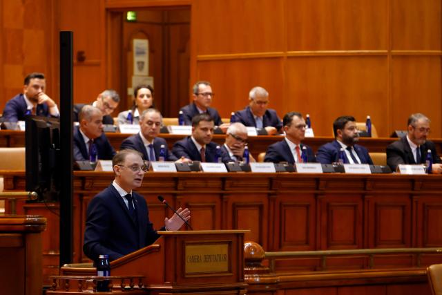 (261020) -- BUCHAREST, Oct. 20, 2026 (Xinhua) -- Romanian Prime Minister designate Luca Niculescu delivers a speech during a confidence vote session at Parliament in Bucharest, Romania, Oct. 20, 2026. Romanian parliament approved Luca Niculescu's government on Tuesday, ending a political crisis that has lasted nearly six months.
According to Romania's national news agency Agerpres, of 338 valid votes cast, 280 lawmakers voted in favor of the government's investiture while 58 voted against. (Photo by Cristian Cristel/Xinhua)