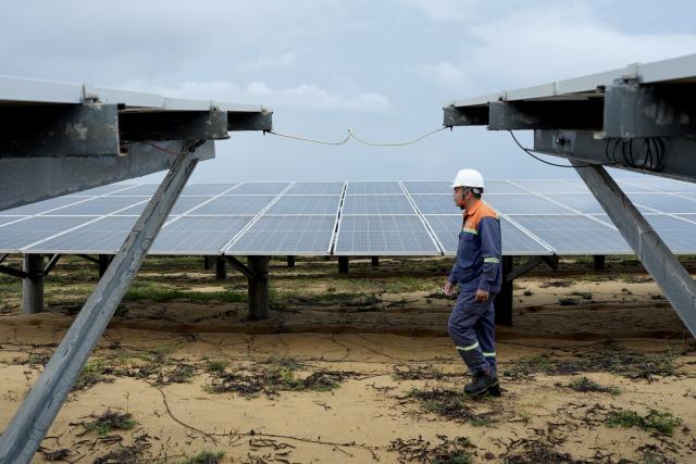 (261020) -- GIA LAI, Oct. 20, 2026 (Xinhua) -- A technician works at the 330-megawatt Phu My Solar Power Plant in Gia Lai province in Vietnam, Oct. 13, 2026. TO GO WITH "Roundup: Fueling developing world's energy transition, China takes green energy global " (Xinhua/Liu Ying)