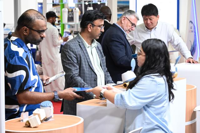 (261020) -- DUBAI, Oct. 20, 2026 (Xinhua) -- People learn about ultrasonic water meters at the booth of Shenke Technology Group from China during the 28th Water, Energy, Technology and Environment Exhibition (WETEX) in Dubai, the United Arab Emirates, Oct. 20, 2026. The 28th WETEX opened Tuesday at the Dubai World Trade Centre in Dubai. (Xinhua/Wang Zecong)