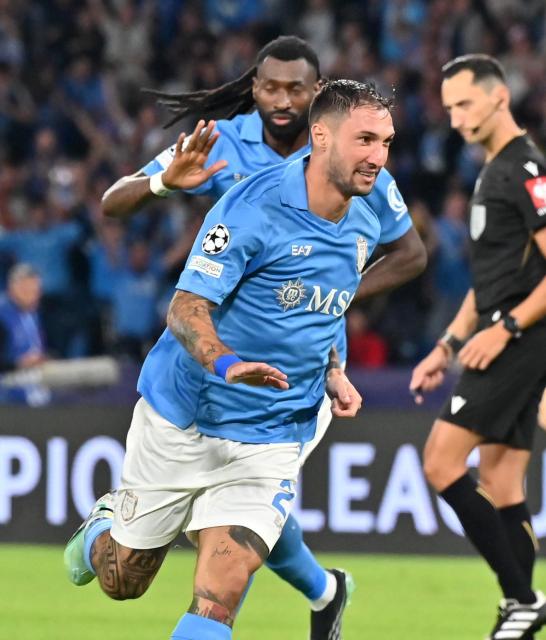 (261021) -- NAPLES, Oct. 21, 2026 (Xinhua) -- Napoli's Matteo Politano (front) celebrates his goal during the UEFA Champions League football match between Napoli and Bodo/Glimt in Naples, Italy, Oct. 20, 2026. (Photo by Augusto Casasoli/Xinhua)