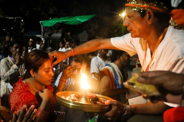 (261021) -- YANGON, Oct. 21, 2026 (Xinhua) -- Devotees celebrate during the Durga Puja, one of the largest Hindu festivals, in Yangon, Myanmar, Oct. 20, 2026. (Xinhua/Myo Kyaw Soe)