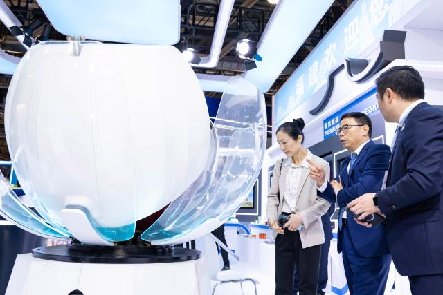 (261021) -- MACAO, Oct. 21, 2026 (Xinhua) -- People visit the 31st Macao International Trade and Investment Fair in Macao, south China, Oct. 21, 2026. The 31st Macao International Trade and Investment Fair, the 2026 Portuguese Speaking Countries Products and Services Exhibition (Macao), and the Macao Franchise Expo 2026, opened here on Wednesday. (Xinhua/Cheong Kam Ka)