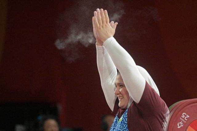 (261021) -- NAGOYA, Oct. 21, 2026 (Xinhua) -- Ruza Kuzieva of Uzbekistan reacts after breaking the world record during the women's up to 73kg finals of Para Powerlifting at the Aichi-Nagoya Asian Para Games in Nagoya, Japan, Oct. 21, 2026. (Xinhua/Then Chih Wey)