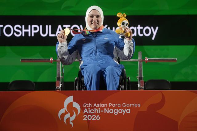 (261021) -- NAGOYA, Oct. 21, 2026 (Xinhua) -- Gold medalist Ruza Kuzieva of Uzbekistan celebrates during the awarding ceremony of the women's up to 73kg finals of Para Powerlifting at the Aichi-Nagoya Asian Para Games in Nagoya, Japan, Oct. 21, 2026. (Xinhua/Then Chih Wey)
