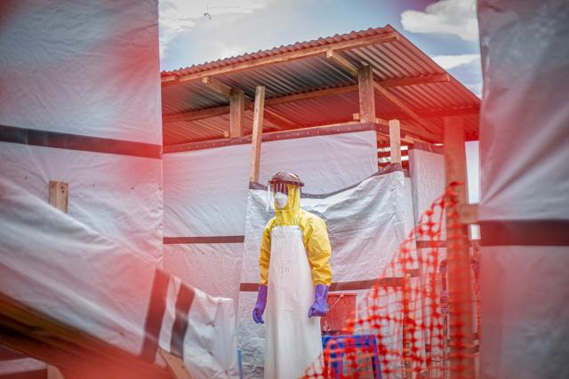 (261021) -- KINSHASA, Oct. 21, 2026 (Xinhua) -- A medical worker patrols at an Ebola treatment center in Bunia, capital of Ituri Province in the Democratic Republic of the Congo (DRC), on Oct. 18, 2026.
  The Africa Centers for Disease Control and Prevention (Africa CDC) has called for greater global solidarity and international support to contain the rapidly expanding Bundibugyo Ebola outbreak.
  TO GO WITH "Africa CDC urges greater global solidarity to contain Ebola as Nigeria confirms 1st case" (Xinhua)