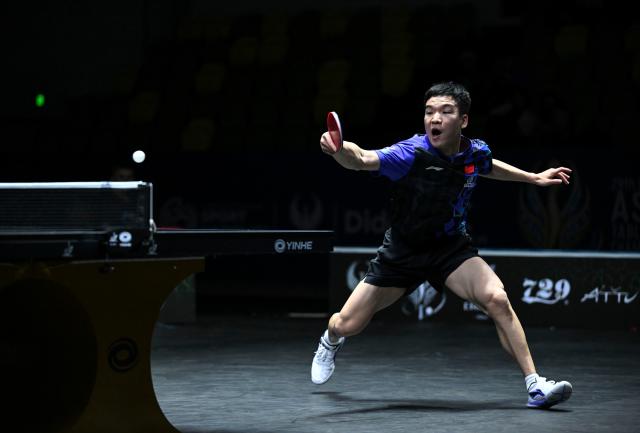 (261021) -- TASHKENT, Oct. 21, 2026 (Xinhua) -- Xiang Peng of China hits a return to Noshad Alamiyan of Iran during the men's teams quarterfinal match between China and Iran at the 29th ITTF-Asian Table Tennis Championships in Tashkent, Uzbekistan, Oct. 21, 2026. (Xinhua/Feng Kaihua)