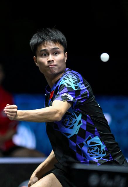 (261021) -- TASHKENT, Oct. 21, 2026 (Xinhua) -- Zhou Qihao of China hits a return to Nima Alamian of Iran during the men's teams quarterfinal match between China and Iran at the 29th ITTF-Asian Table Tennis Championships in Tashkent, Uzbekistan, Oct. 21, 2026. (Xinhua/Feng Kaihua)