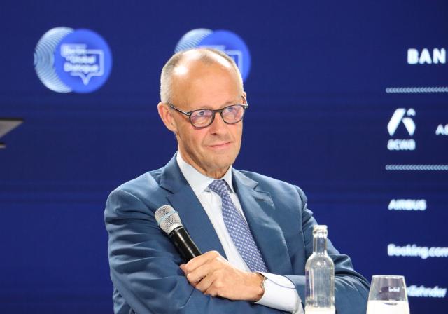 (261021) -- BERLIN, Oct. 21, 2026 (Xinhua) -- German Chancellor Friedrich Merz attends the Berlin Global Dialogue in Berlin, Germany, Oct. 21, 2026. German Chancellor Friedrich Merz said on Wednesday that the European Union (EU) needs to protect its industries against unfair competition while keeping its markets open and avoiding a trade war. (Xinhua/Li Hanlin)