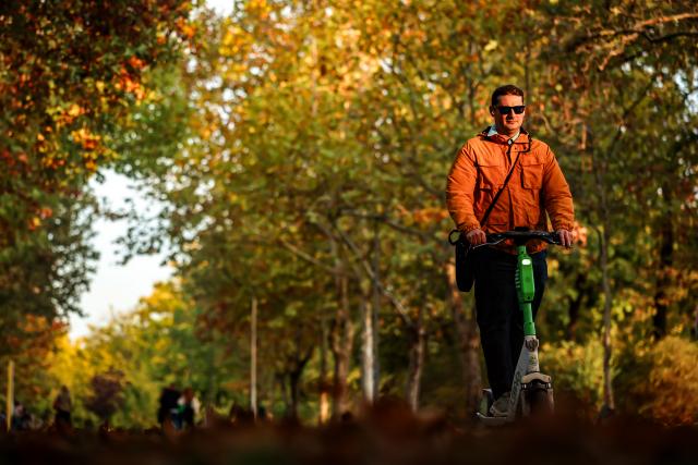(261021) -- BUDAPEST, Oct. 21, 2026 (Xinhua) -- A man rides a scooter in the City Park in Budapest, Hungary, Oct. 21, 2026. (Photo by David Balogh/Xinhua)