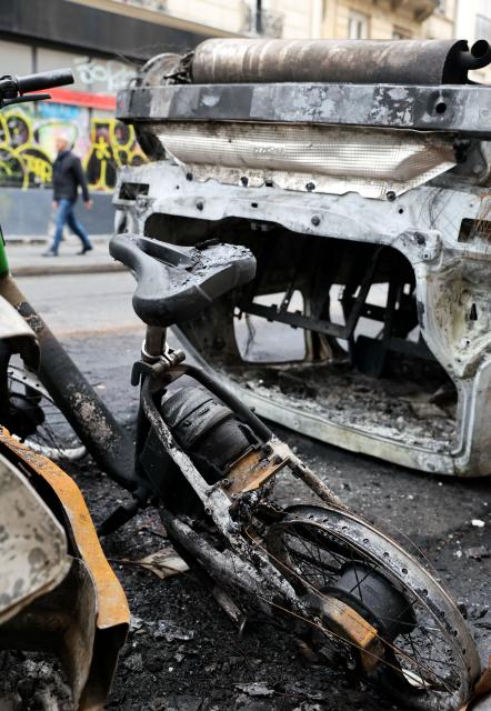 (261021) -- PARIS, Oct. 21, 2026 (Xinhua) -- Vehicles destroyed by fire during the earlier demonstration are seen on a street in Paris, France, Oct. 21, 2026. The French government has vowed to do everything within its power to prevent violence at fresh social demonstrations announced for Saturday, after riots around the country caused widespread destruction and thousands of arrests on Oct. 17. (Xinhua/Wu Huiwo)