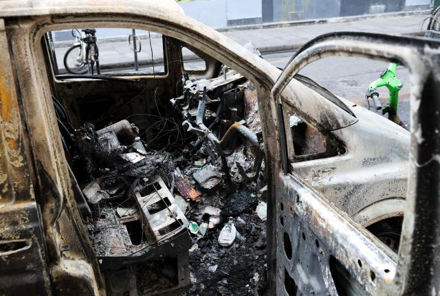 (261021) -- PARIS, Oct. 21, 2026 (Xinhua) -- A vehicle destroyed by fire during the earlier demonstration is seen on a street in Paris, France, Oct. 21, 2026. The French government has vowed to do everything within its power to prevent violence at fresh social demonstrations announced for Saturday, after riots around the country caused widespread destruction and thousands of arrests on Oct. 17. (Xinhua/Wu Huiwo)