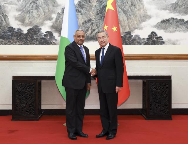 (261021) -- BEIJING, Oct. 21, 2026 (Xinhua) -- Chinese Foreign Minister Wang Yi, also a member of the Political Bureau of the Communist Party of China Central Committee, meets with Abdoulkader Houssein Omar, Minister of Foreign Affairs and International Cooperation of Djibouti, in Beijing, capital of China, Oct. 21, 2026. (Xinhua/Ding Haitao)