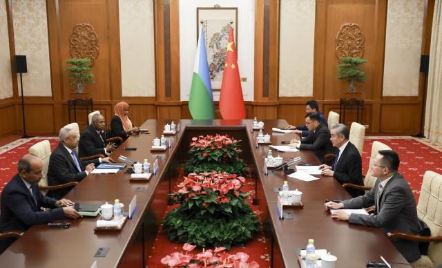 (261021) -- BEIJING, Oct. 21, 2026 (Xinhua) -- Chinese Foreign Minister Wang Yi, also a member of the Political Bureau of the Communist Party of China Central Committee, meets with Abdoulkader Houssein Omar, Minister of Foreign Affairs and International Cooperation of Djibouti, in Beijing, capital of China, Oct. 21, 2026. (Xinhua/Ding Haitao)