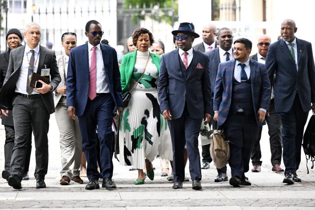 (261022) -- CAPE TOWN, Oct. 22, 2026 (Xinhua) -- South African Finance Minister Enoch Godongwana (3rd R, front) arrives at the Parliament to deliver the Medium-Term Budget Policy Statement in Cape Town, South Africa, Oct. 21, 2026.
  South Africa has lowered its economic growth forecast for 2026 to 1.2 percent and announced temporary fuel levy cuts to ease cost-of-living pressures, Finance Minister Enoch Godongwana said on Wednesday.
  TO GO WITH "South Africa lowers 2026 growth forecast, cuts fuel levies to ease cost pressures" (Photo by Xabiso Mkhabela/Xinhua)