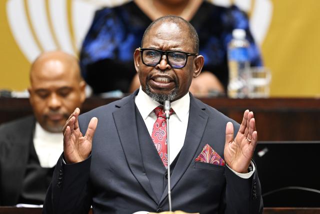 (261022) -- CAPE TOWN, Oct. 22, 2026 (Xinhua) -- South African Finance Minister Enoch Godongwana delivers the Medium-Term Budget Policy Statement in Parliament in Cape Town, South Africa, Oct. 21, 2026.
  South Africa has lowered its economic growth forecast for 2026 to 1.2 percent and announced temporary fuel levy cuts to ease cost-of-living pressures, Finance Minister Enoch Godongwana said on Wednesday.
  TO GO WITH "South Africa lowers 2026 growth forecast, cuts fuel levies to ease cost pressures" (Photo by Xabiso Mkhabela/Xinhua)