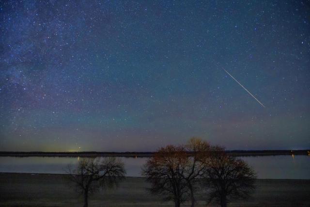 (261022) -- HARBIN, Oct. 22, 2026 (Xinhua) -- This photo taken on Oct. 22, 2026 shows the Orionid meteor shower in the sky over Jiayin County, northeast China's Heilongjiang Province. The Orionid meteor shower, caused by remnants from Halley's comet, peaked on Wednesday and Thursday. (Photo by Li Shaojun/Xinhua)