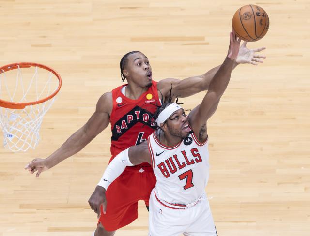 (261022) --  TORONTO, Oct. 22, 2026 (Xinhua) -- Buddy Hield (front) of Chicago Bulls fights for a rebound with Scottie Barnes of Toronto Raptors during the 2026-2027 NBA regular season game between Toronto Raptors and Chicago Bulls in Toronto, Canada, on Oct. 21, 2026. (Photo by Zou Zheng/Xinhua)