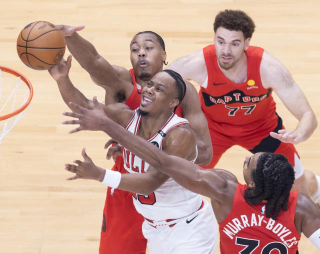 (261022) --  TORONTO, Oct. 22, 2026 (Xinhua) -- Isaac Okoro (L, front) of Chicago Bulls goes for a layup during the 2026-2027 NBA regular season game between Toronto Raptors and Chicago Bulls in Toronto, Canada, on Oct. 21, 2026. (Photo by Zou Zheng/Xinhua)